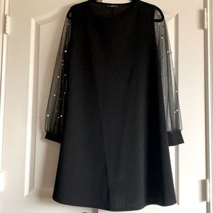 Black dress with pearl details